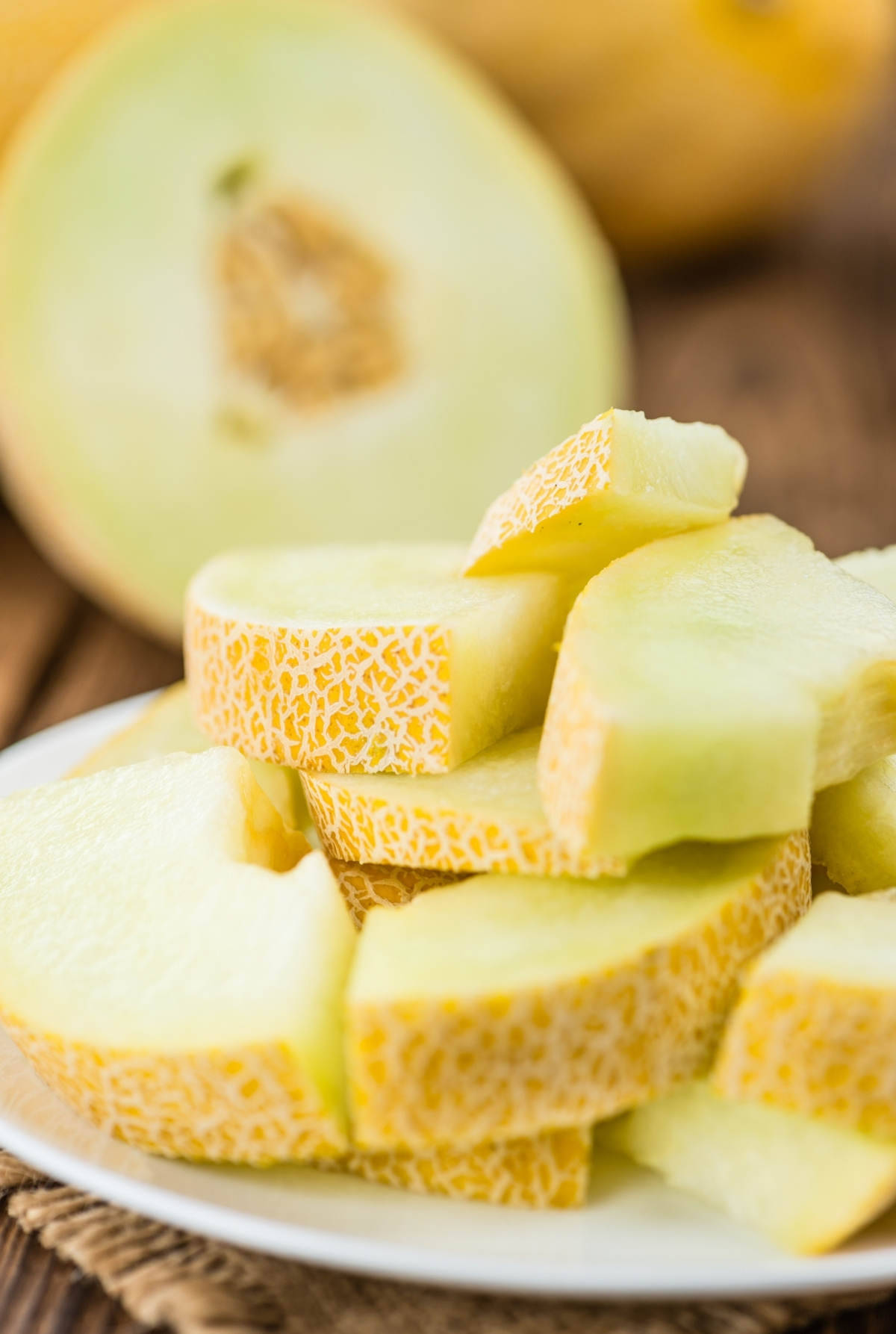 Sliced Brown Honeydew Melon On A Plate Wallpaper