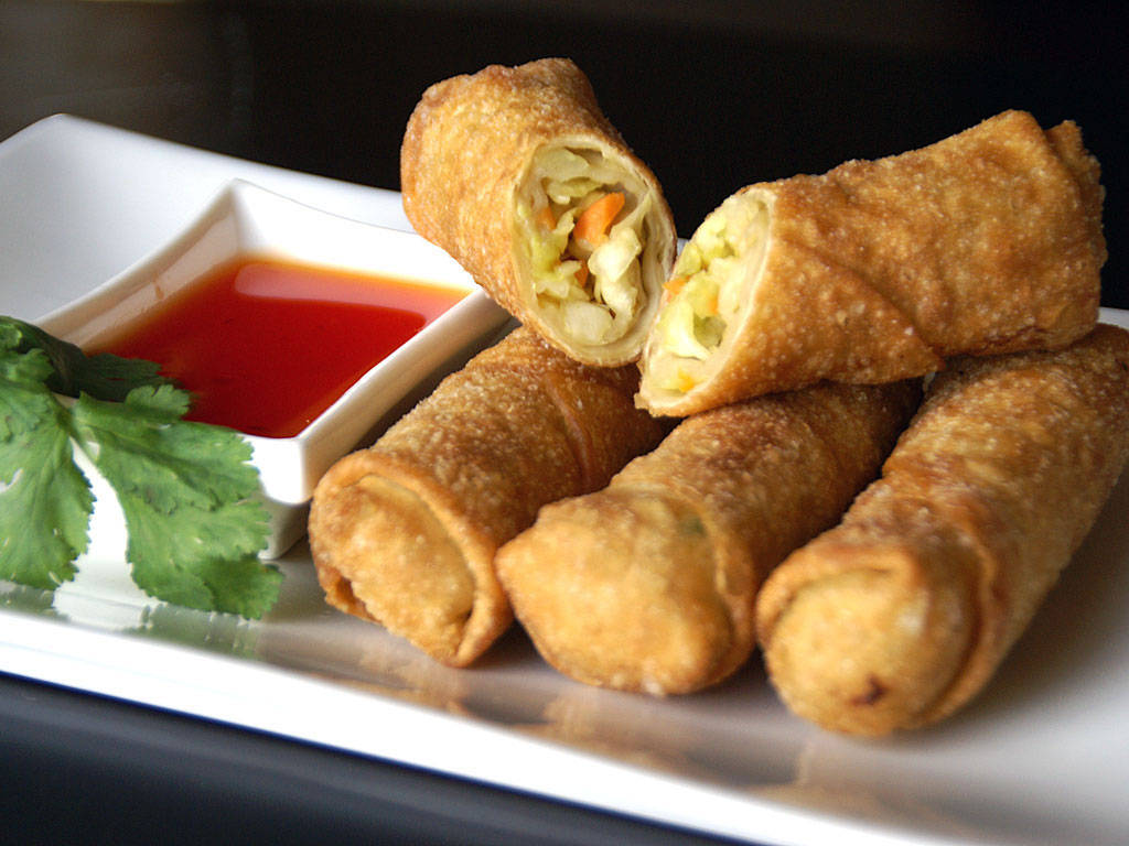 Sliced Egg Rolls With Sweet Sauce Dip Wallpaper