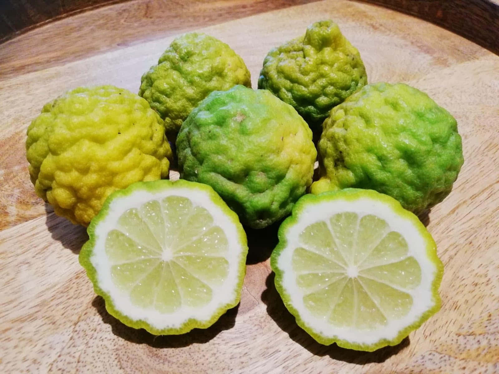 Sliced Kaffir Lime Fruits On Table Wallpaper