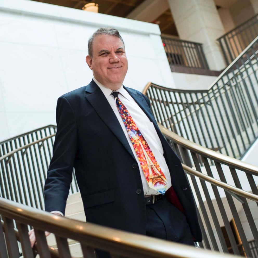 Smiling Alan Grayson Downstairs Wallpaper