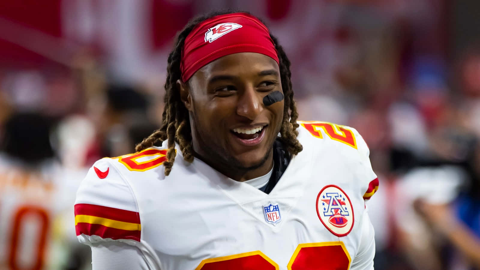 Smiling Football Player Kansas City Chiefs Uniform Wallpaper