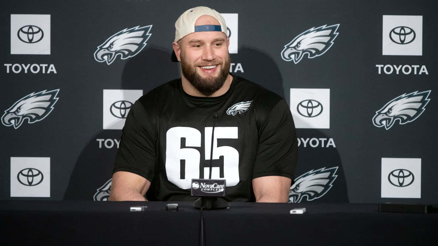 Smiling Football Player Press Conference Wallpaper