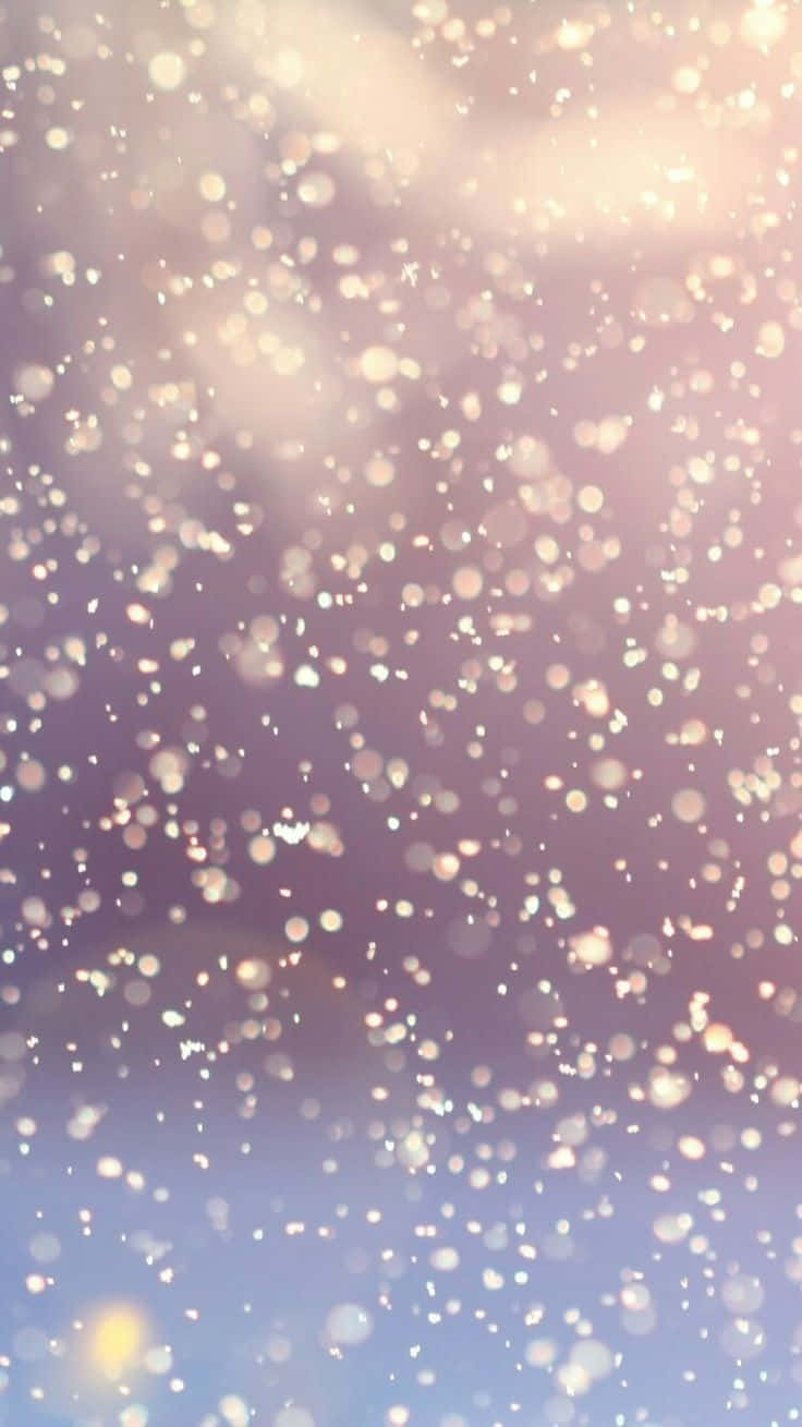 Snow Falling On A Blue Sky Wallpaper