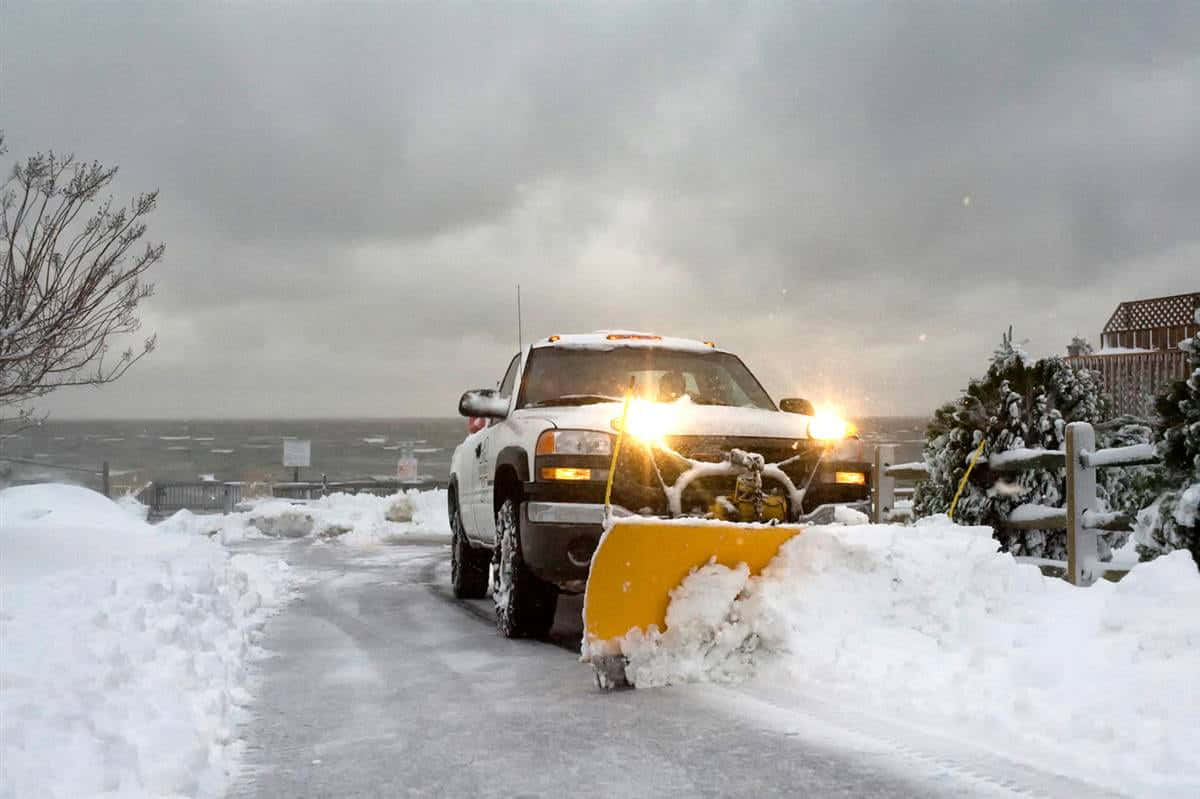 Snowplow Clearing A Snowy Road Wallpaper