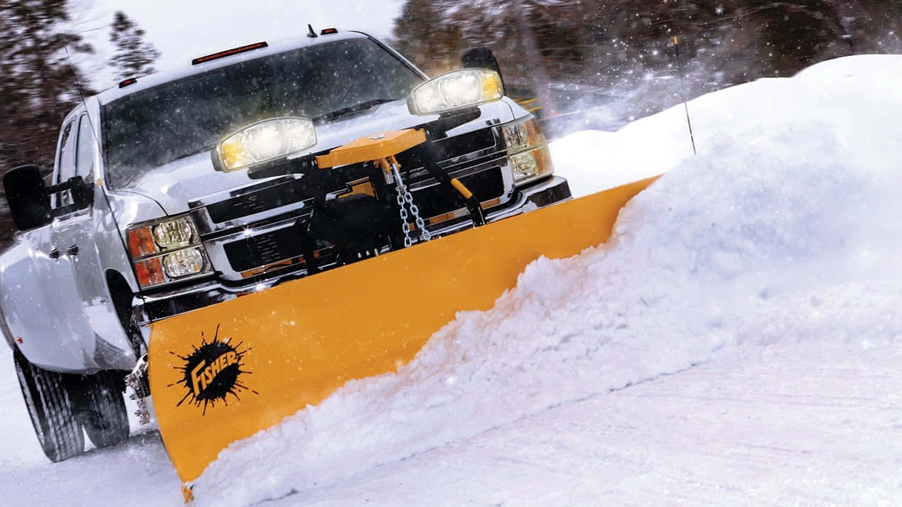 Snowplow Clearing The Road On A Snowy Day Wallpaper