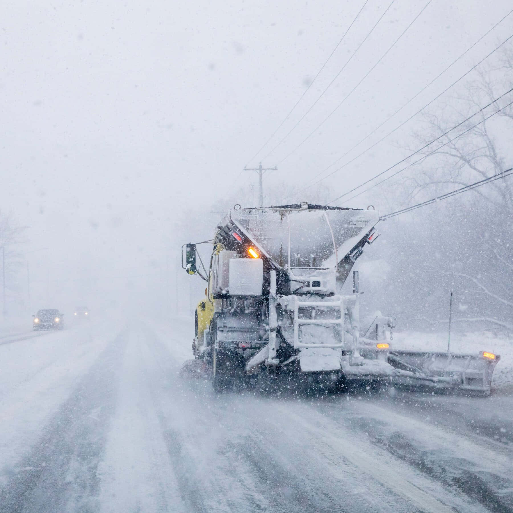 Snowplow Truck Clearing The Road During Wintertime Wallpaper