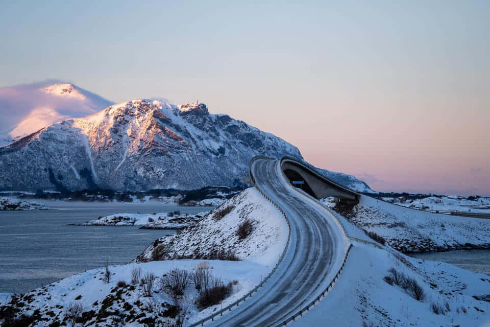 Snowy Storseisundet Bridge During Winter Wallpaper