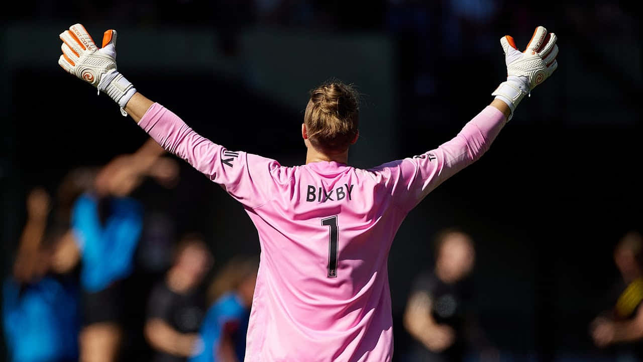 Soccer Goalkeeper Bella Bixby Raising Arms Wallpaper