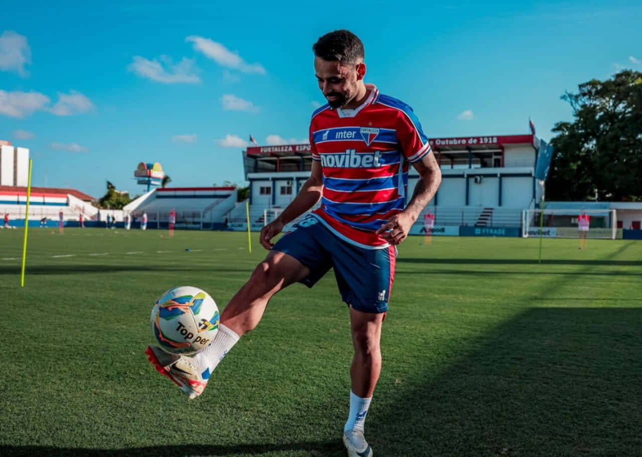 Soccer Player Controling Ball During Training Wallpaper