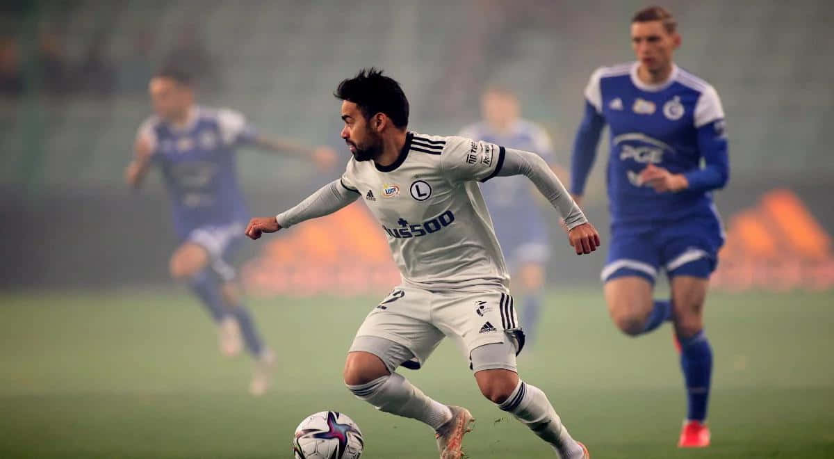 Soccer_ Player_in_ Action_on_ Foggy_ Field Wallpaper