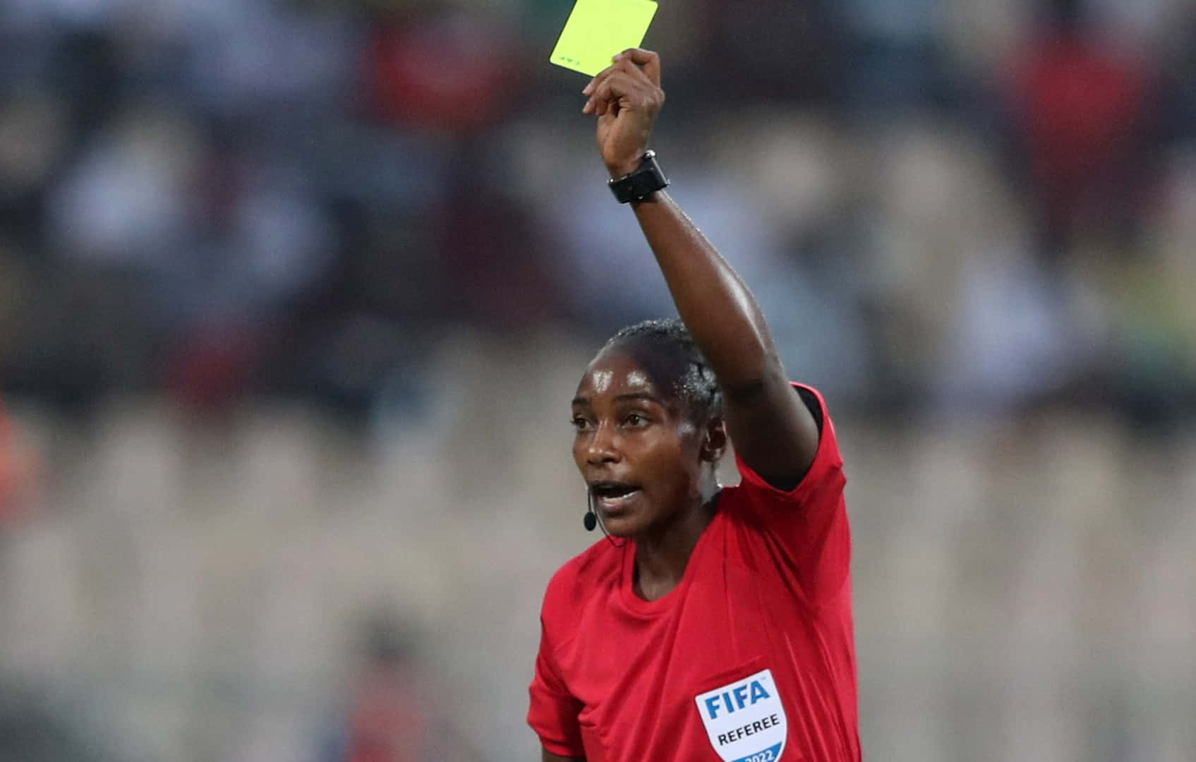 Soccer Referee Issuing Yellow Card Wallpaper