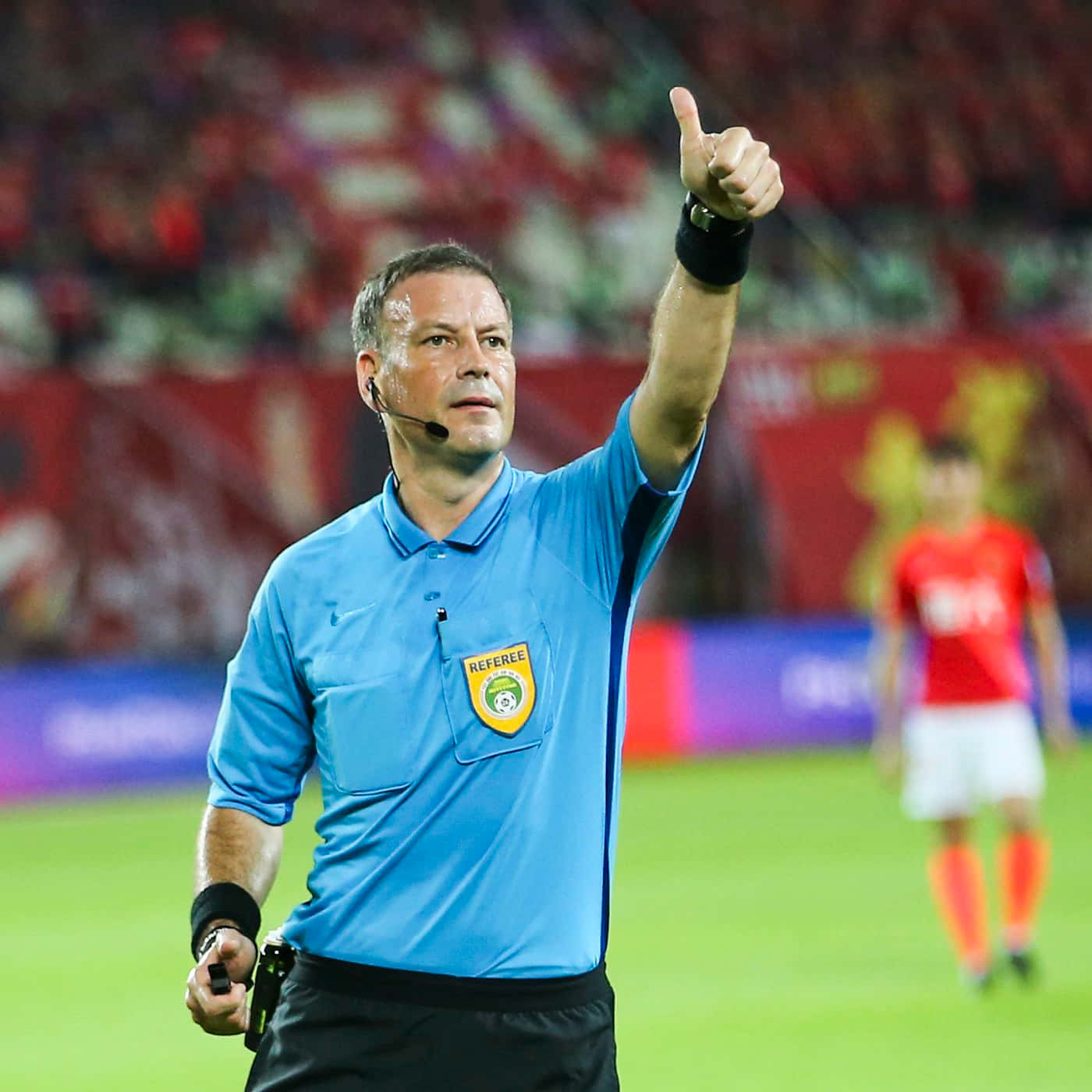 Soccer Referee Signaling During Match.jpg Wallpaper