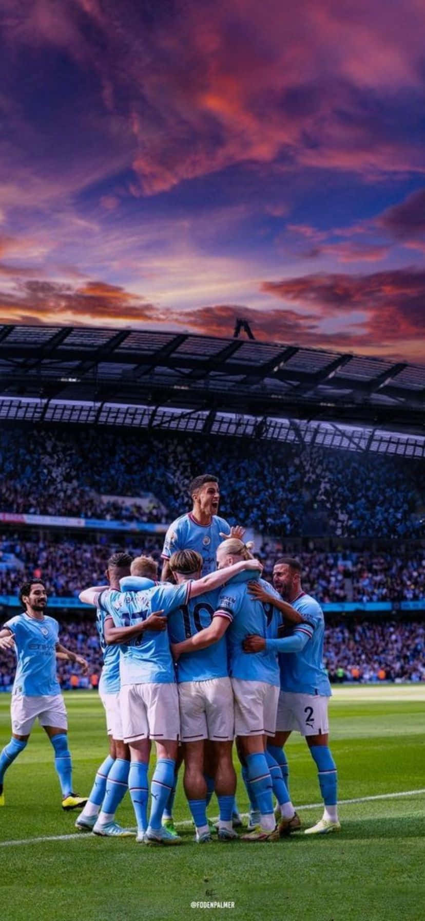 Soccer Team Celebrationat Dusk Wallpaper