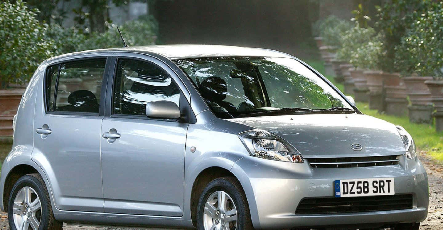 Sophisticated Daihatsu Sirion On Road Wallpaper