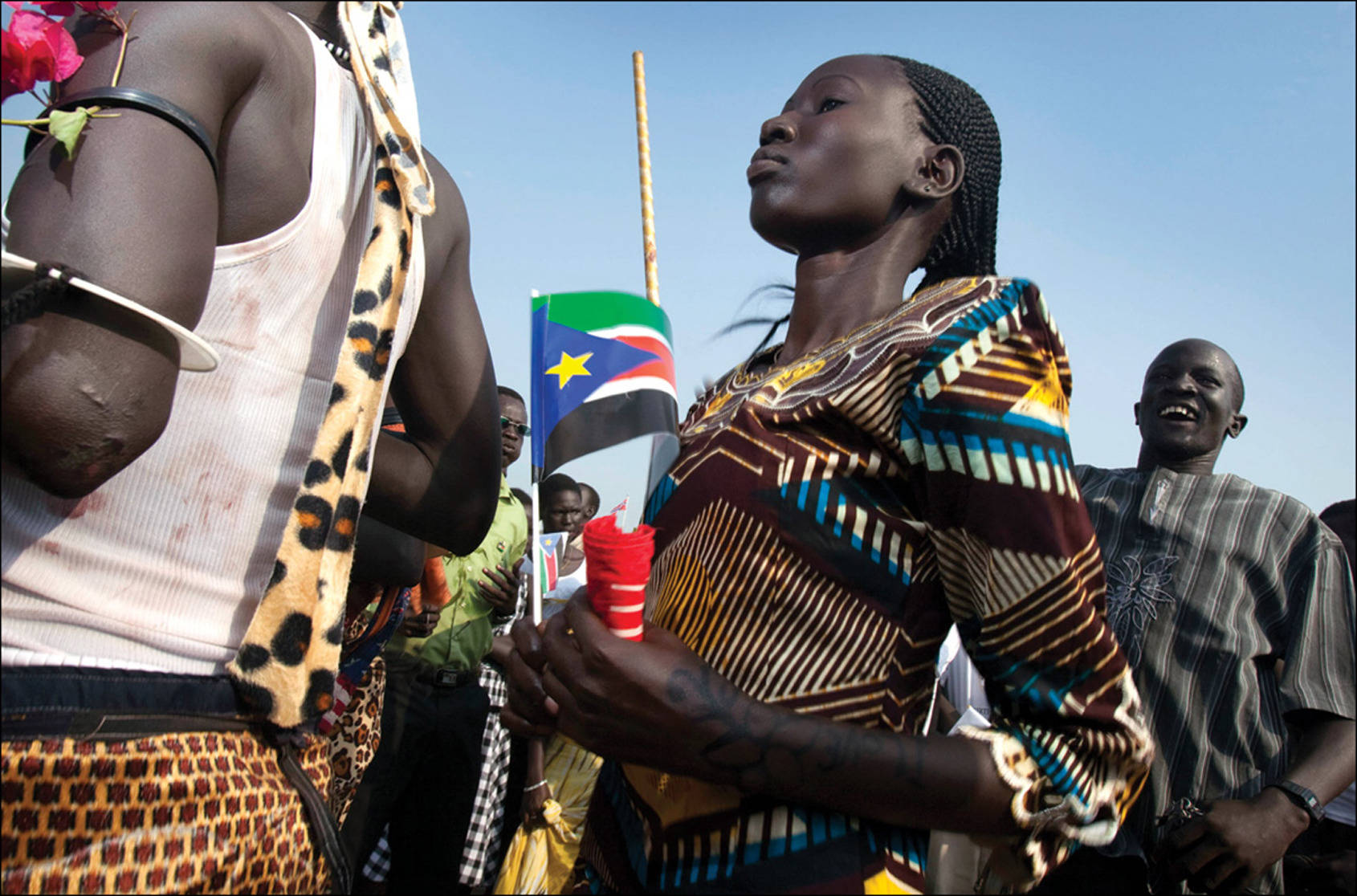 South Sudan Woman Holding Flag Wallpaper