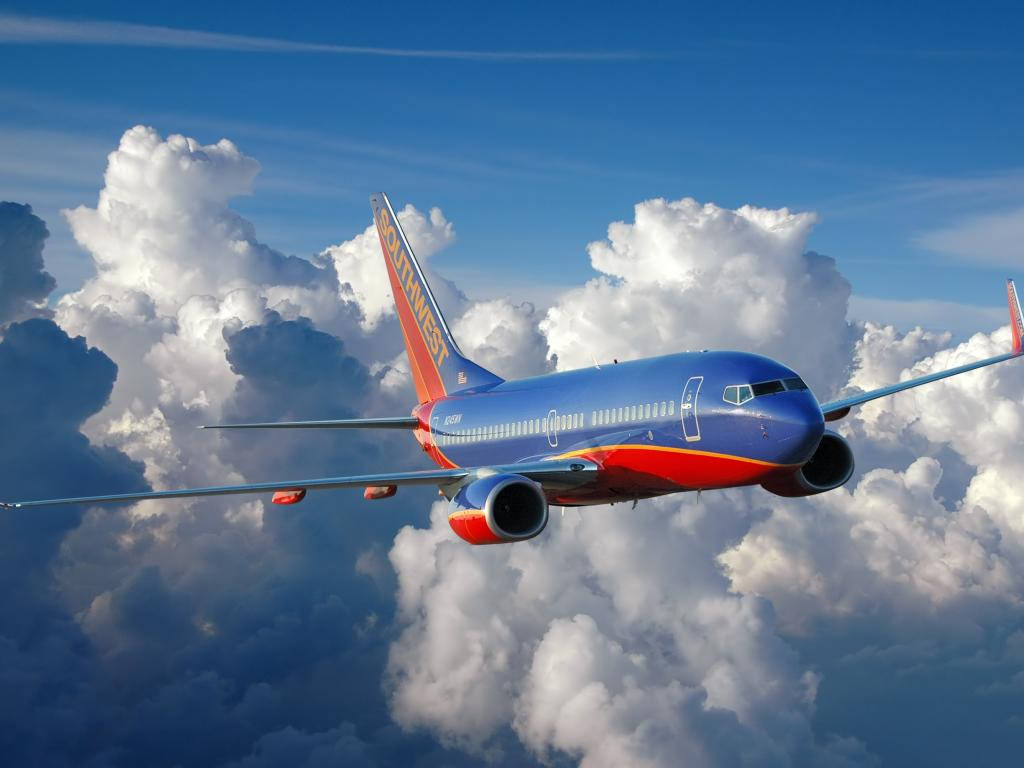 Southwest Airlines Airplane In Sea Of Clouds Wallpaper