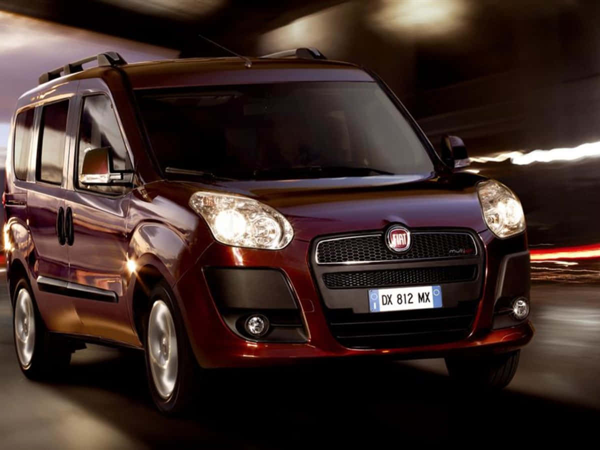 Spacious Fiat Doblo Cruising On Roads Wallpaper