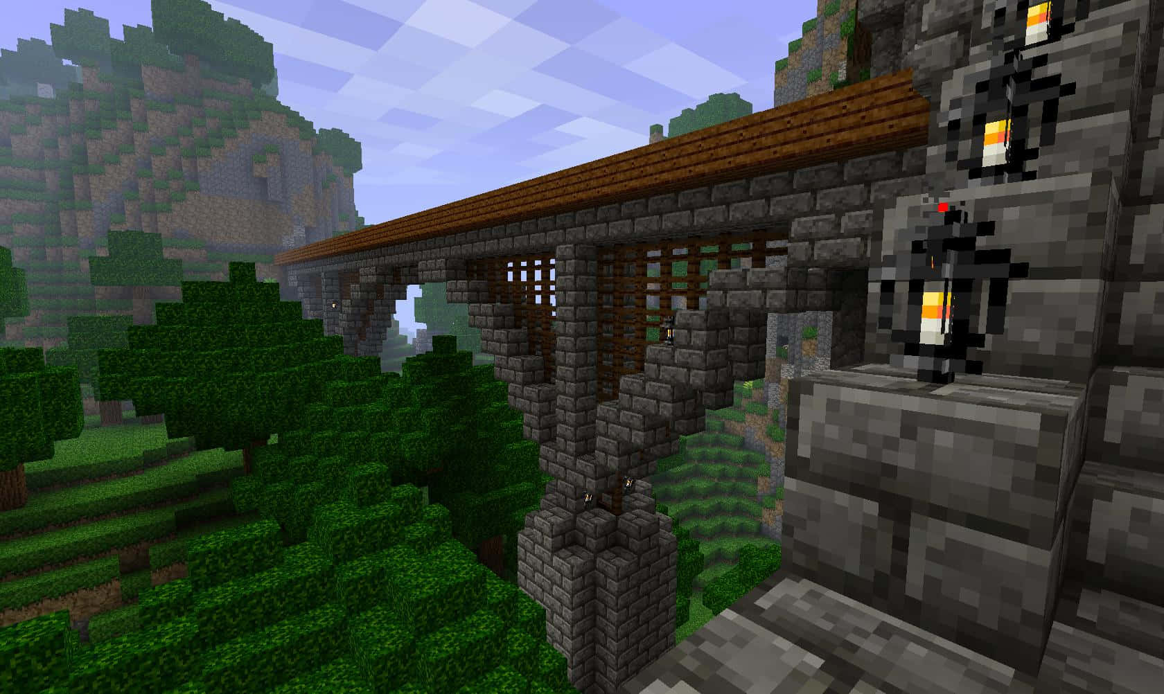 Spectacular Minecraft Bridge Amidst A Serene Landscape Wallpaper