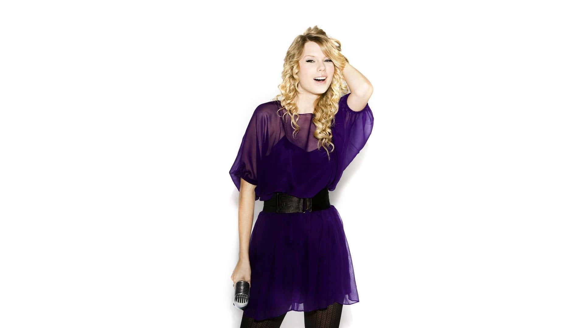 Stand Out In Style In This Fun And Unique Purple Dress! Wallpaper