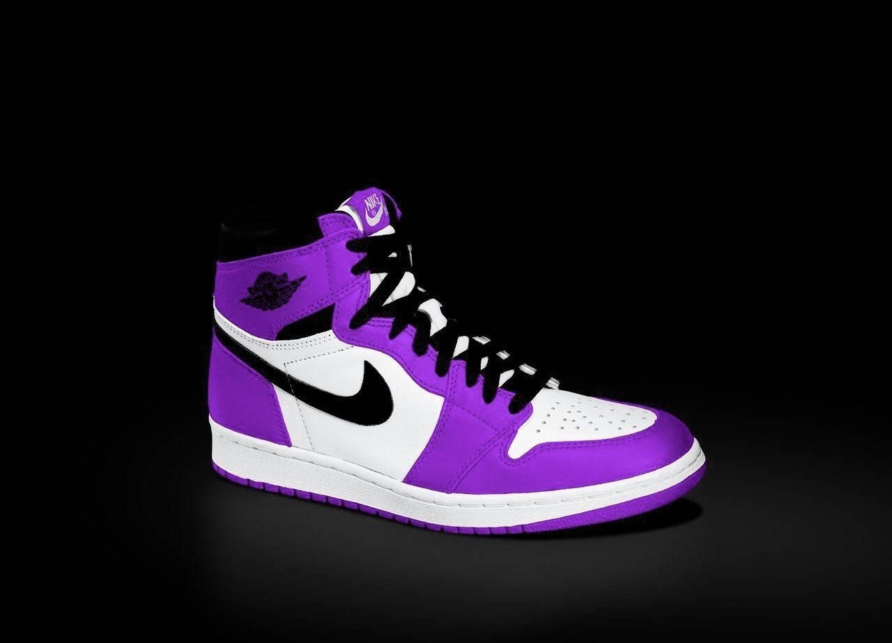 Stand Out Of The Crowd With These Iconic Purple Jordans Wallpaper