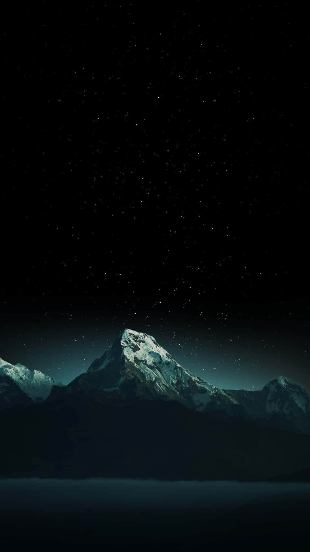 Starry Night Over Snowy Mountain Peaks Wallpaper