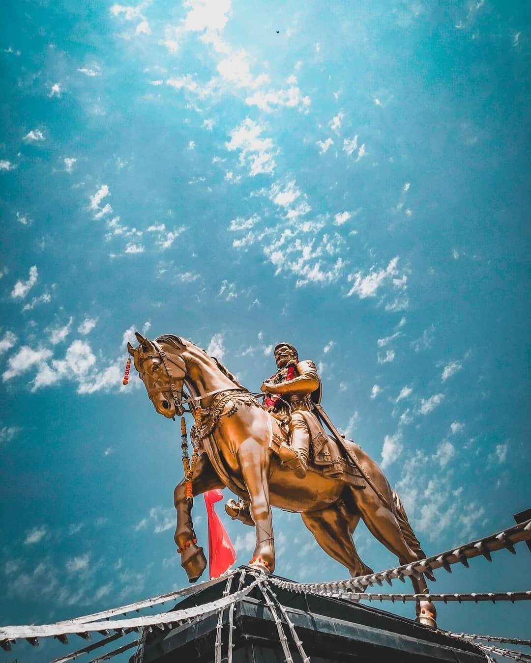 Statue Of Shivaji Maharaj Under The Sky Wallpaper