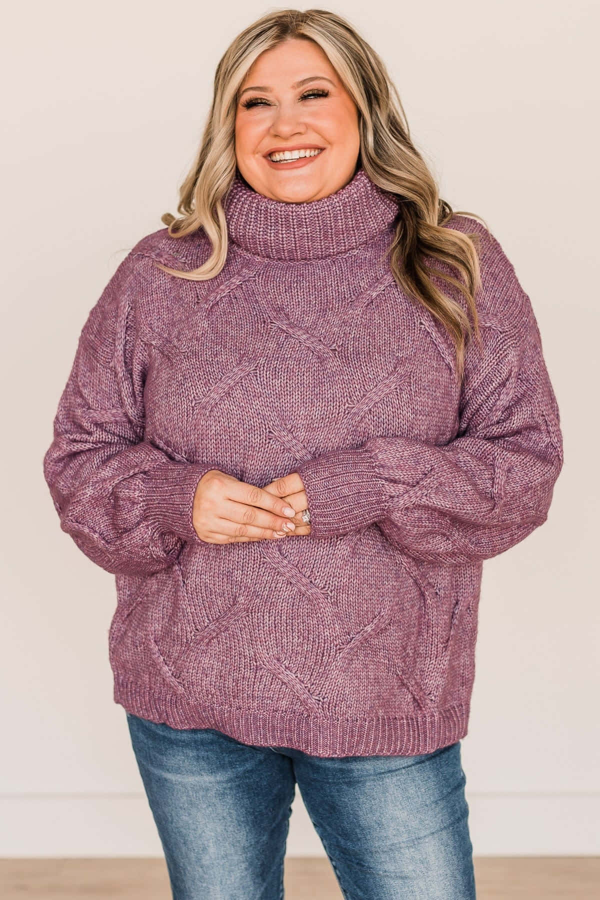 Stay Cozy And Look Trendy With Our New Selection Of Purple Turtle Neck Sweaters! Wallpaper