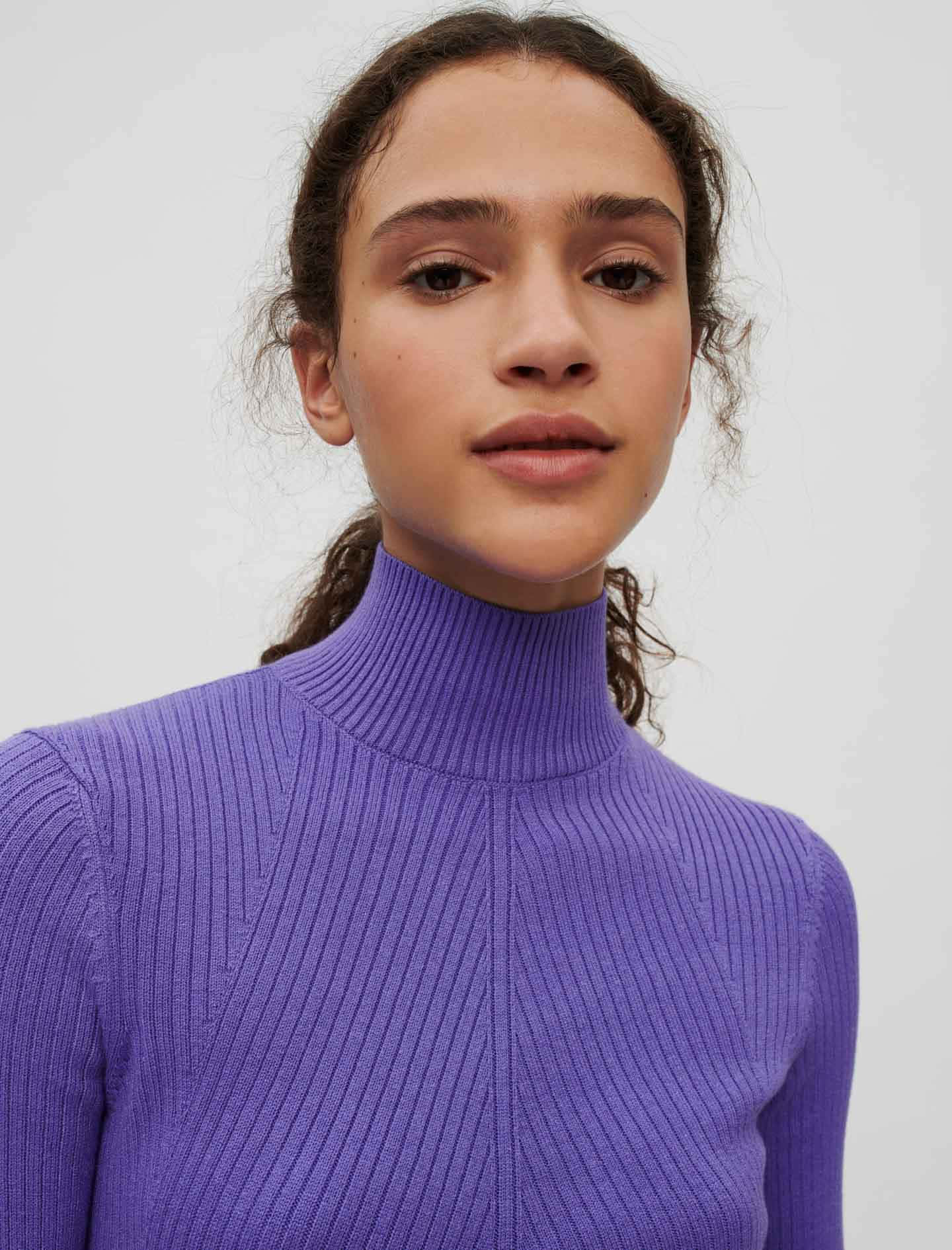 Stay Warm And Comfortable In The Classic Style Of The Purple Turtle-neck Sweater. Wallpaper