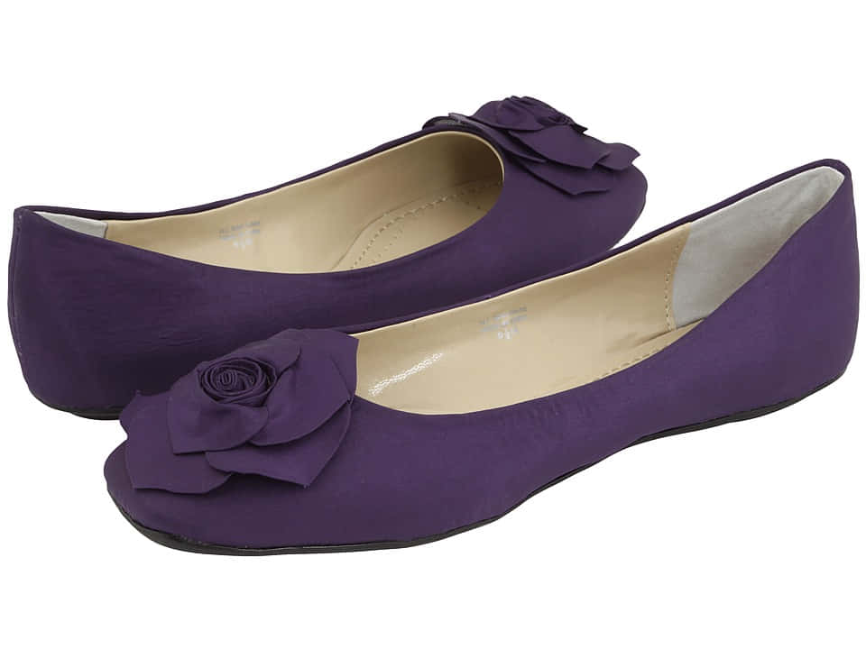 Step Into Style With A Pair Of Purple Shoes Wallpaper