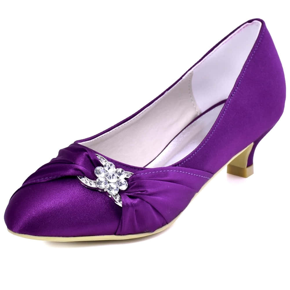 Step Out In Style In Our Collection Of Trendy Purple Shoes Wallpaper