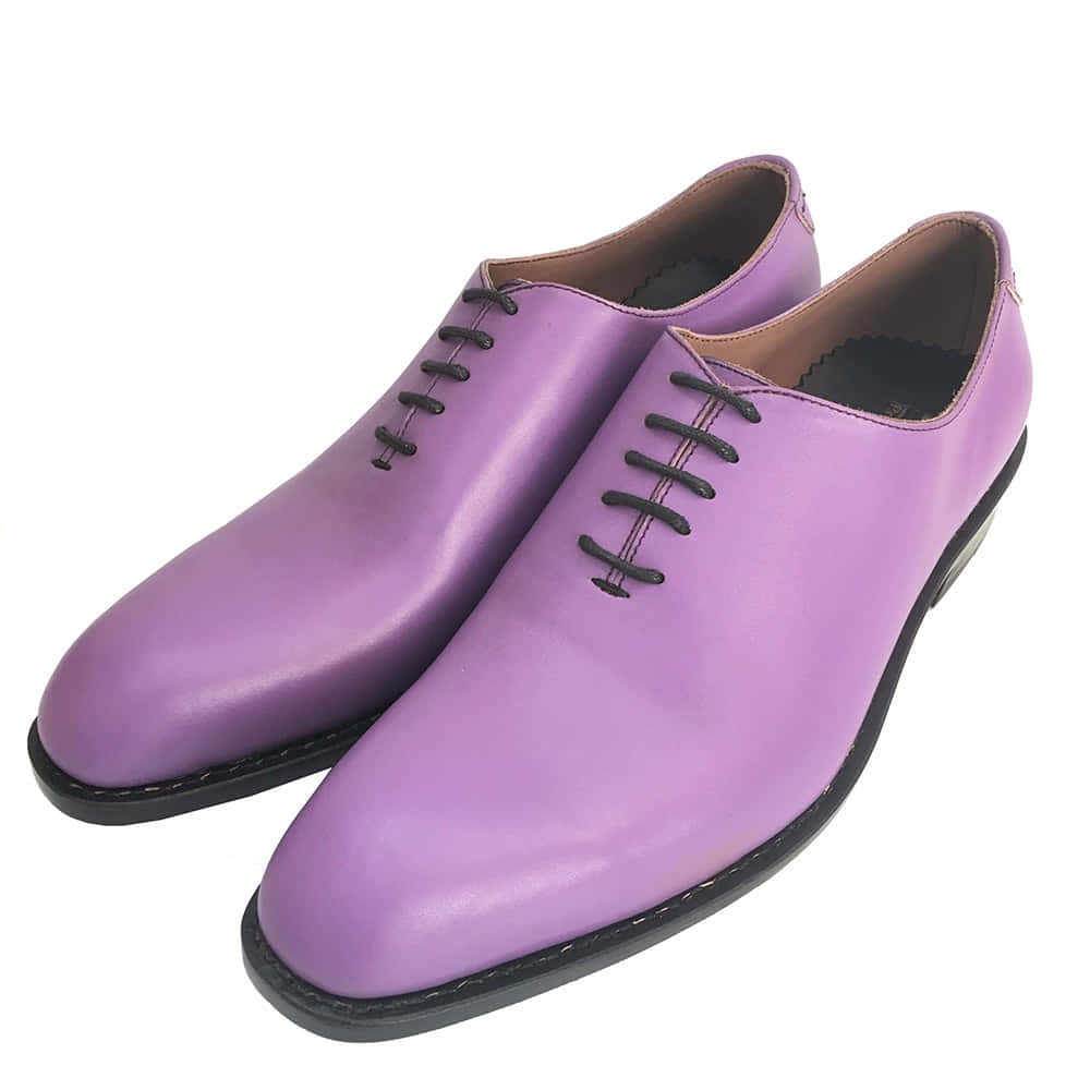 Step Up Your Style Game With A Pair Of Stylish Purple Shoes. Wallpaper