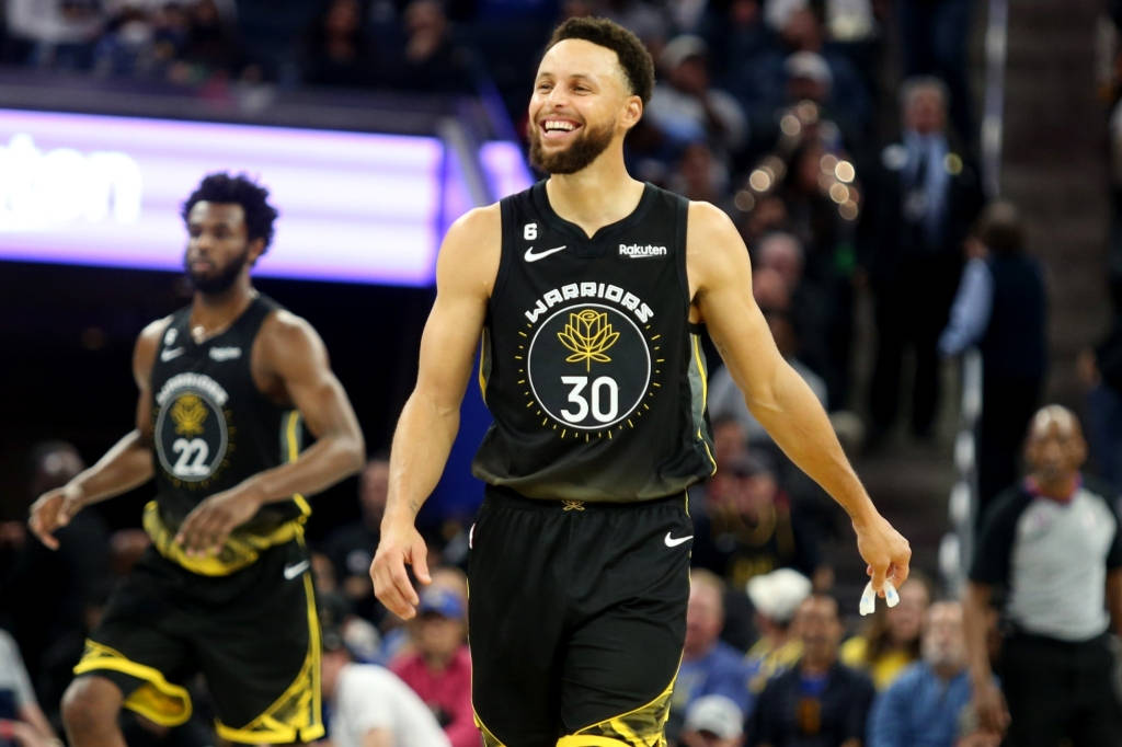 Steph Curry Smiling While Walking On Court Wallpaper