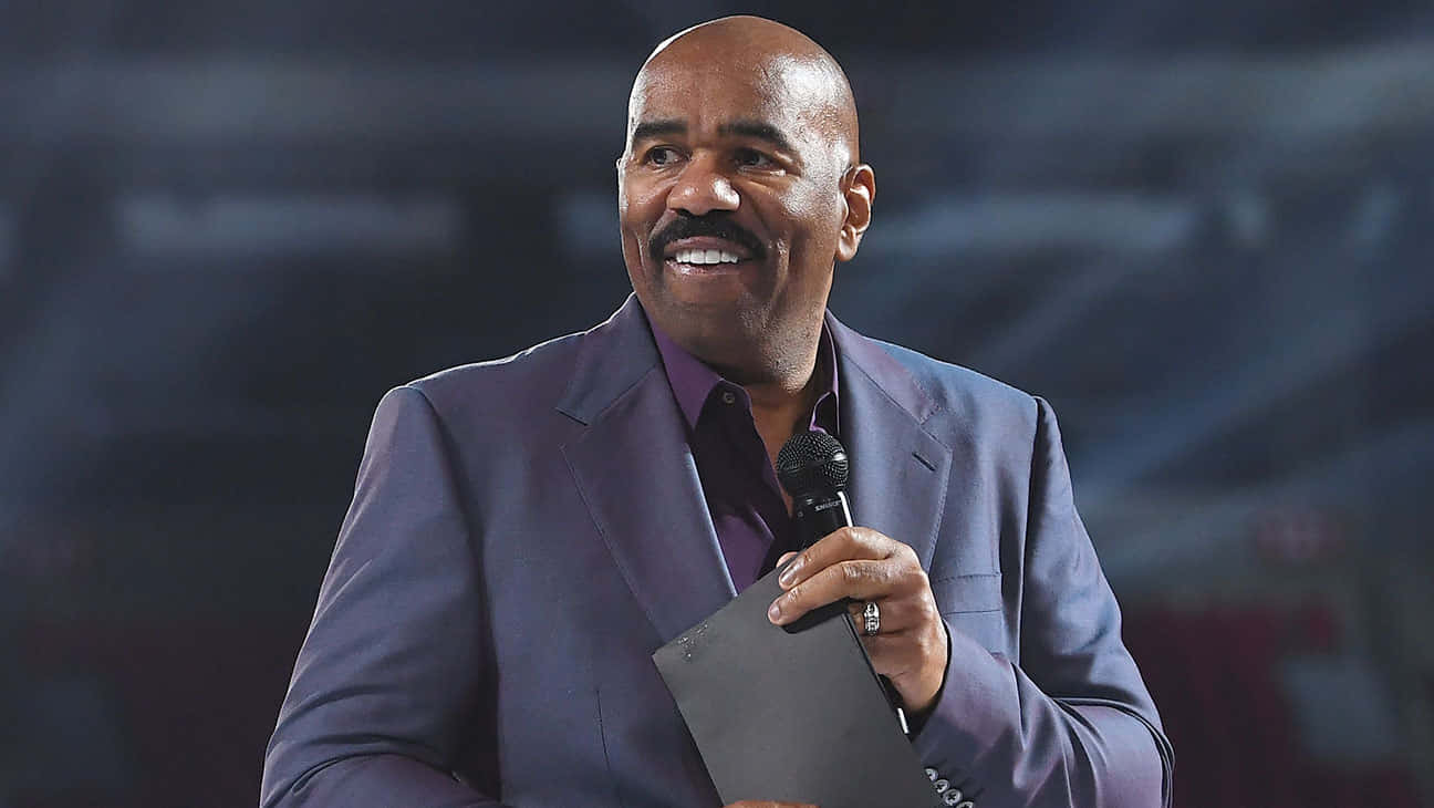 Steve Harvey In A Blue-gray Suit Wallpaper