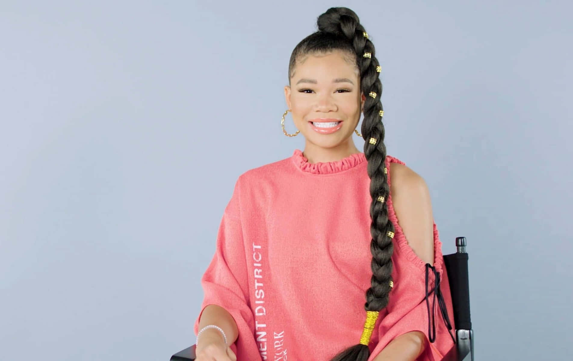 Storm Reid Smilingin Pink Sweatshirt Wallpaper