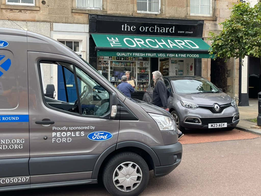 Street Scene Outside The Orchard Shop Wallpaper