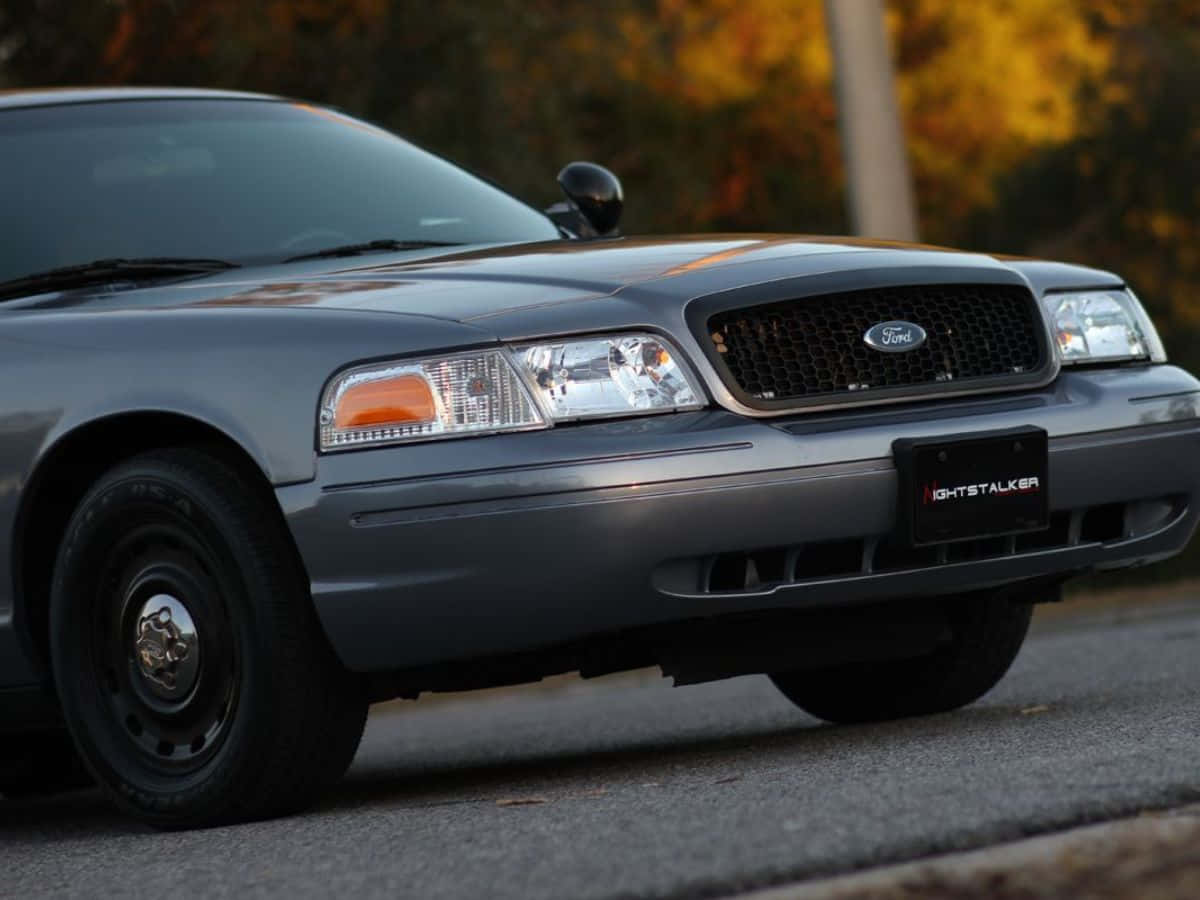 Striking Ford Crown Victoria On The Open Road Wallpaper