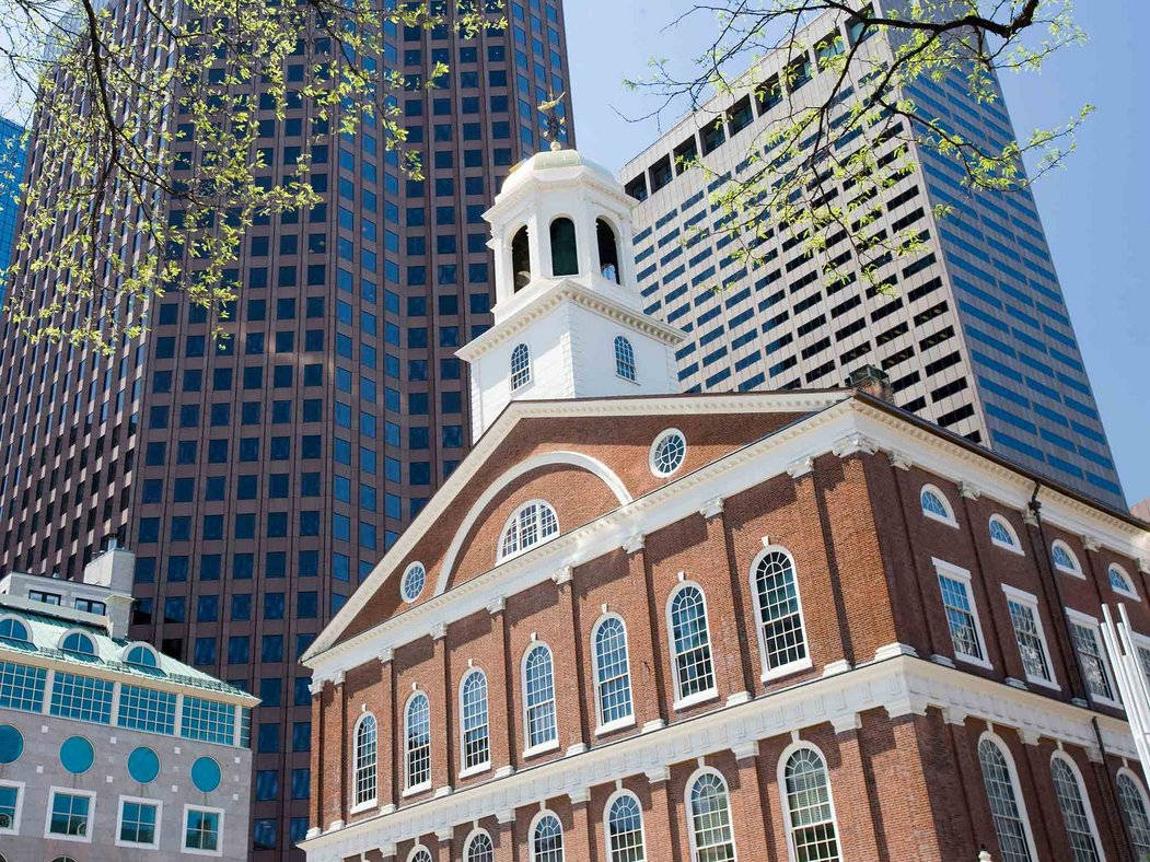 Striking View Of Faneuil Hall Amidst Tall Buildings In Boston Wallpaper