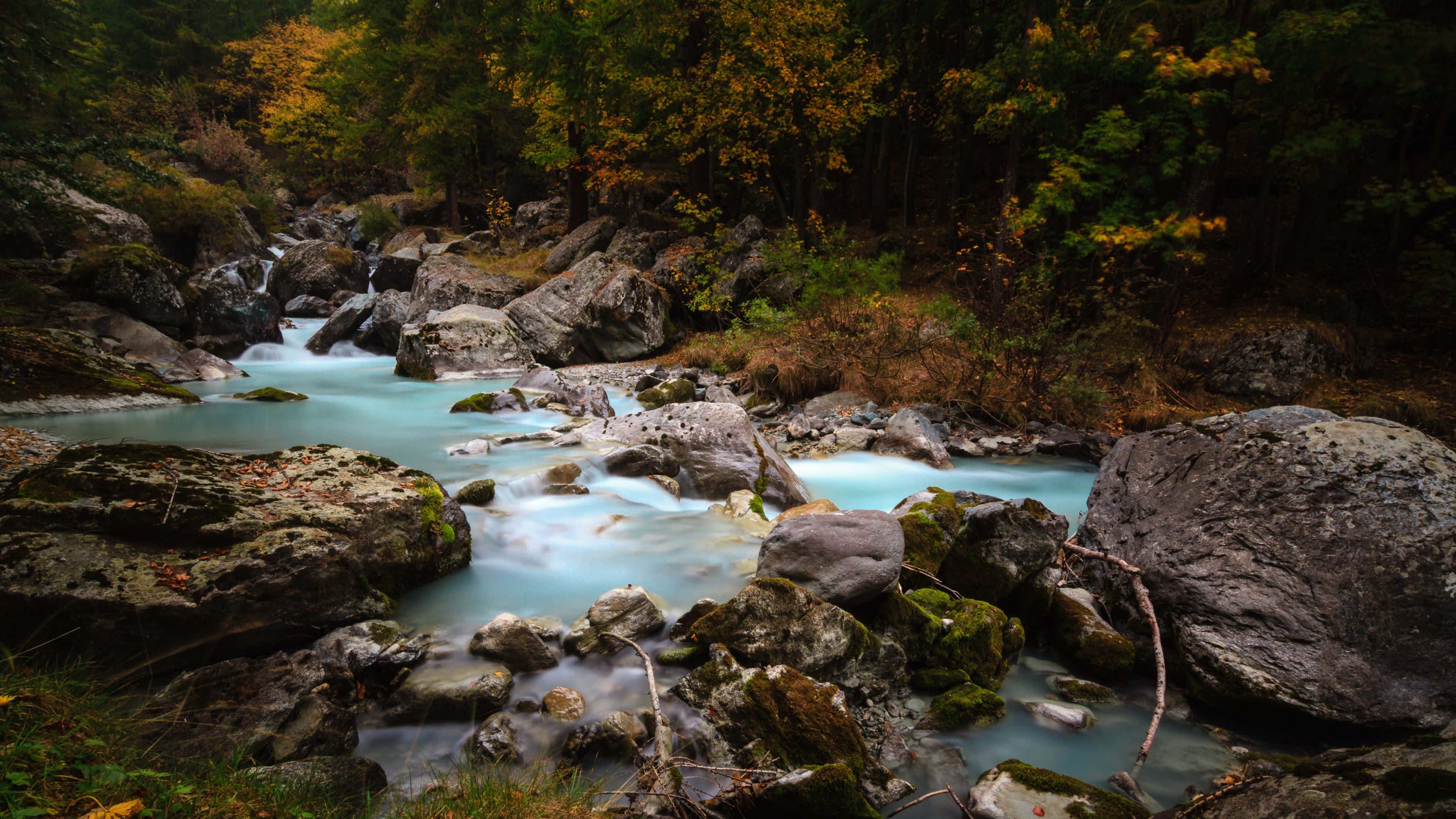 Stunning 4k View Of A Serene River Wallpaper