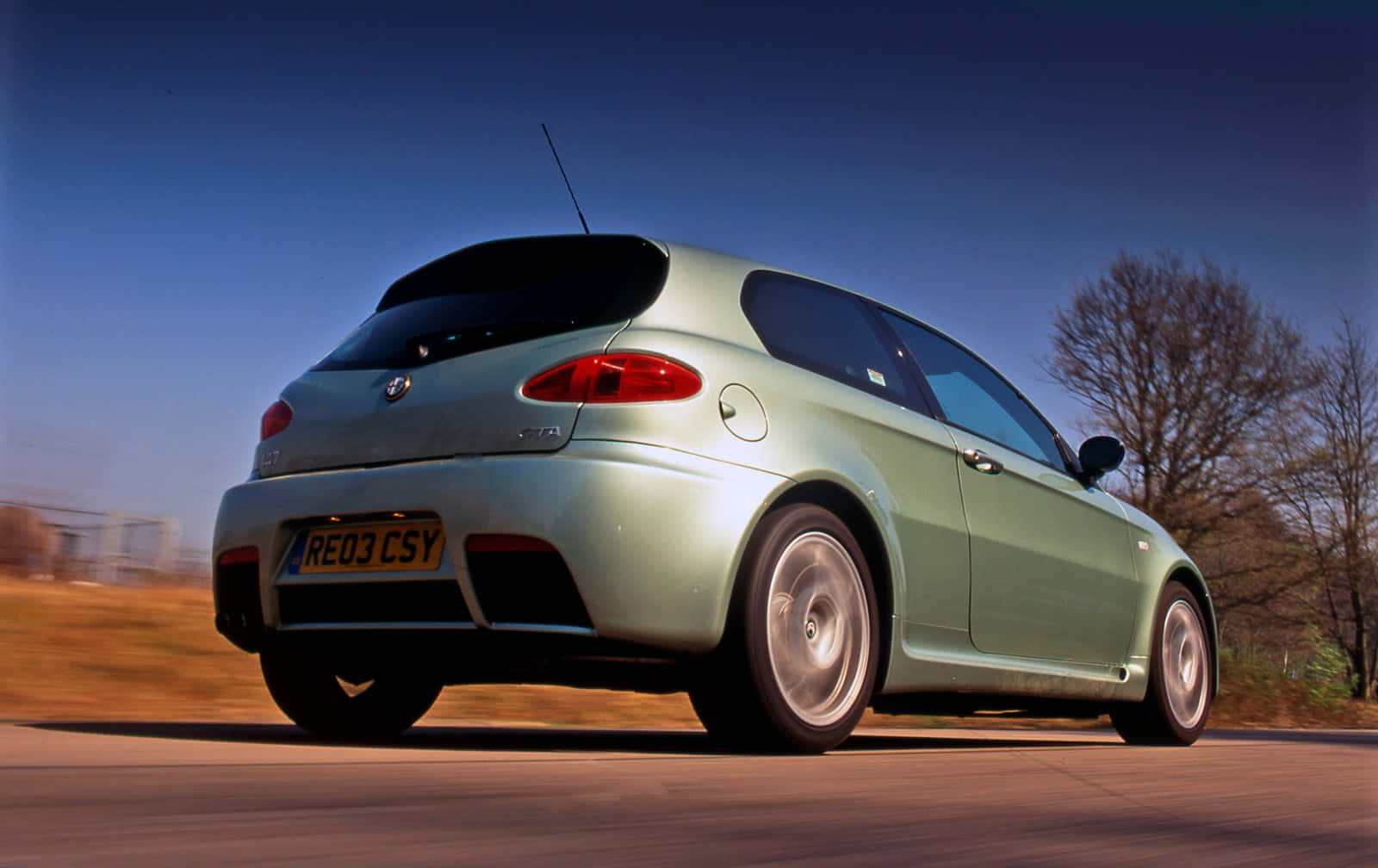 Stunning Alfa Romeo 147 Parked By The Waterfront Wallpaper