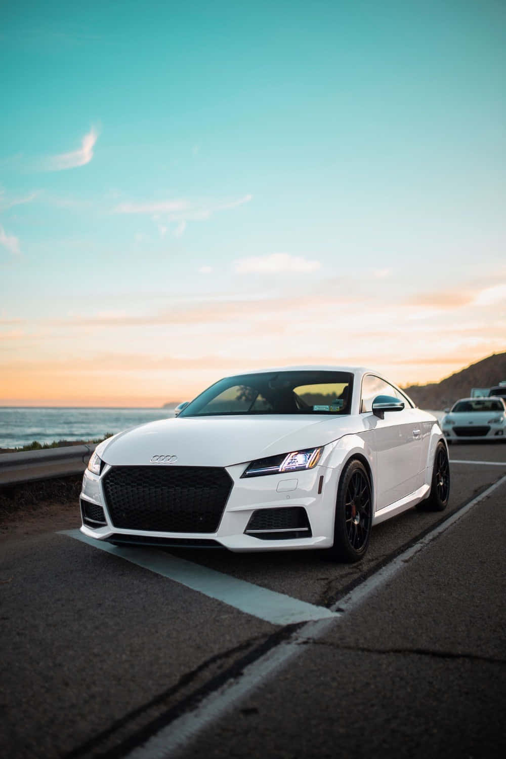 Stunning Audi Tt Rs Posing Under The Sky Wallpaper