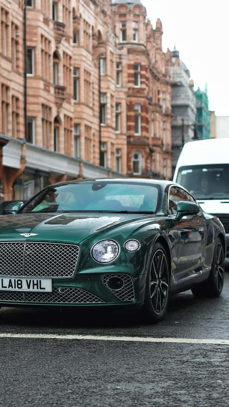 Stunning Bentley Continental Gt Illuminated At Night Wallpaper