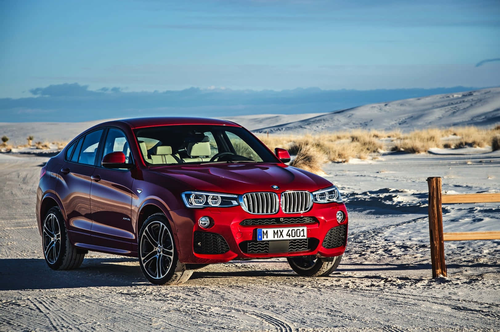 Stunning Bmw X4 Cruising On The Highway Wallpaper