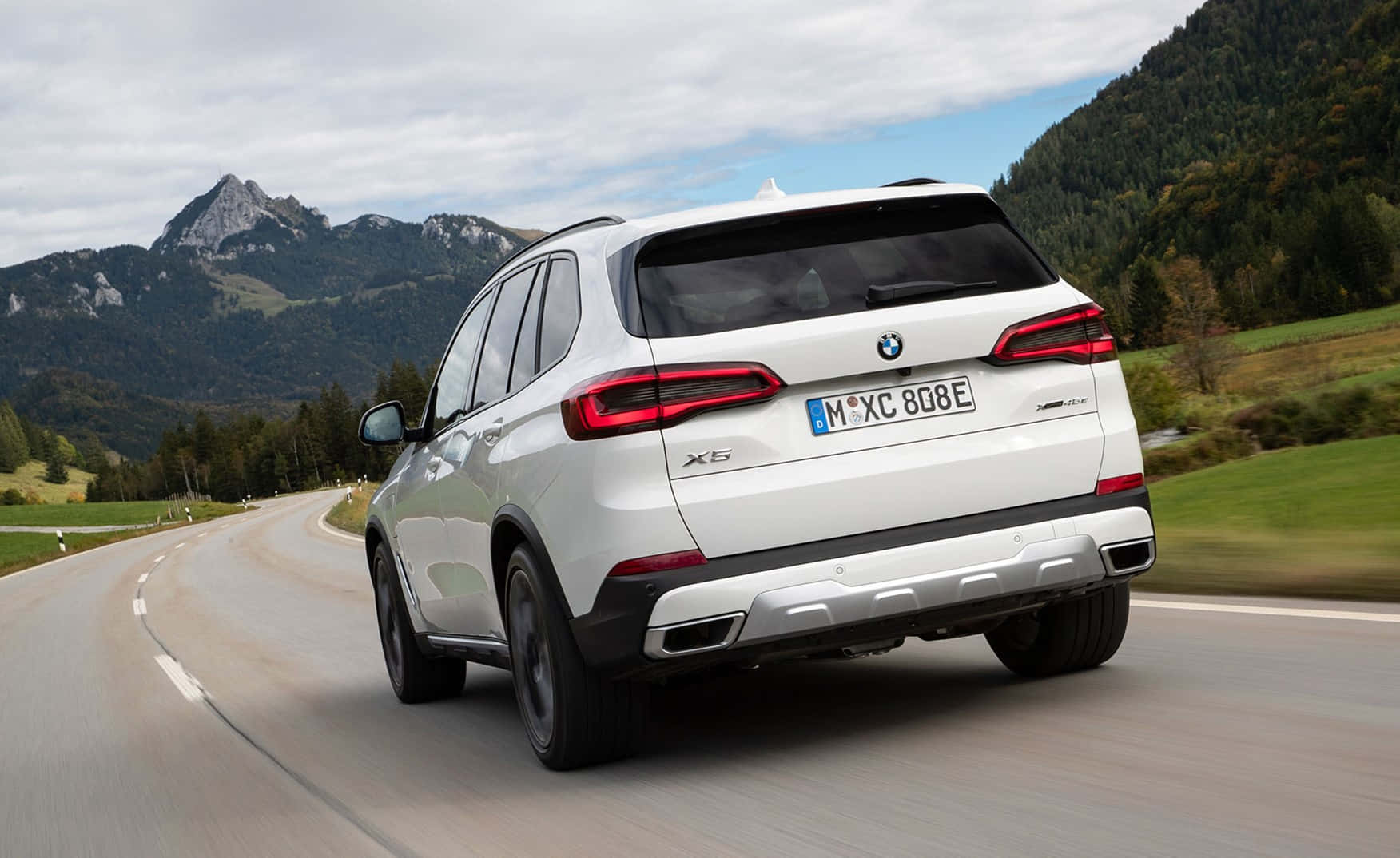 Stunning Bmw X5 Amidst A Scenic Backdrop Wallpaper