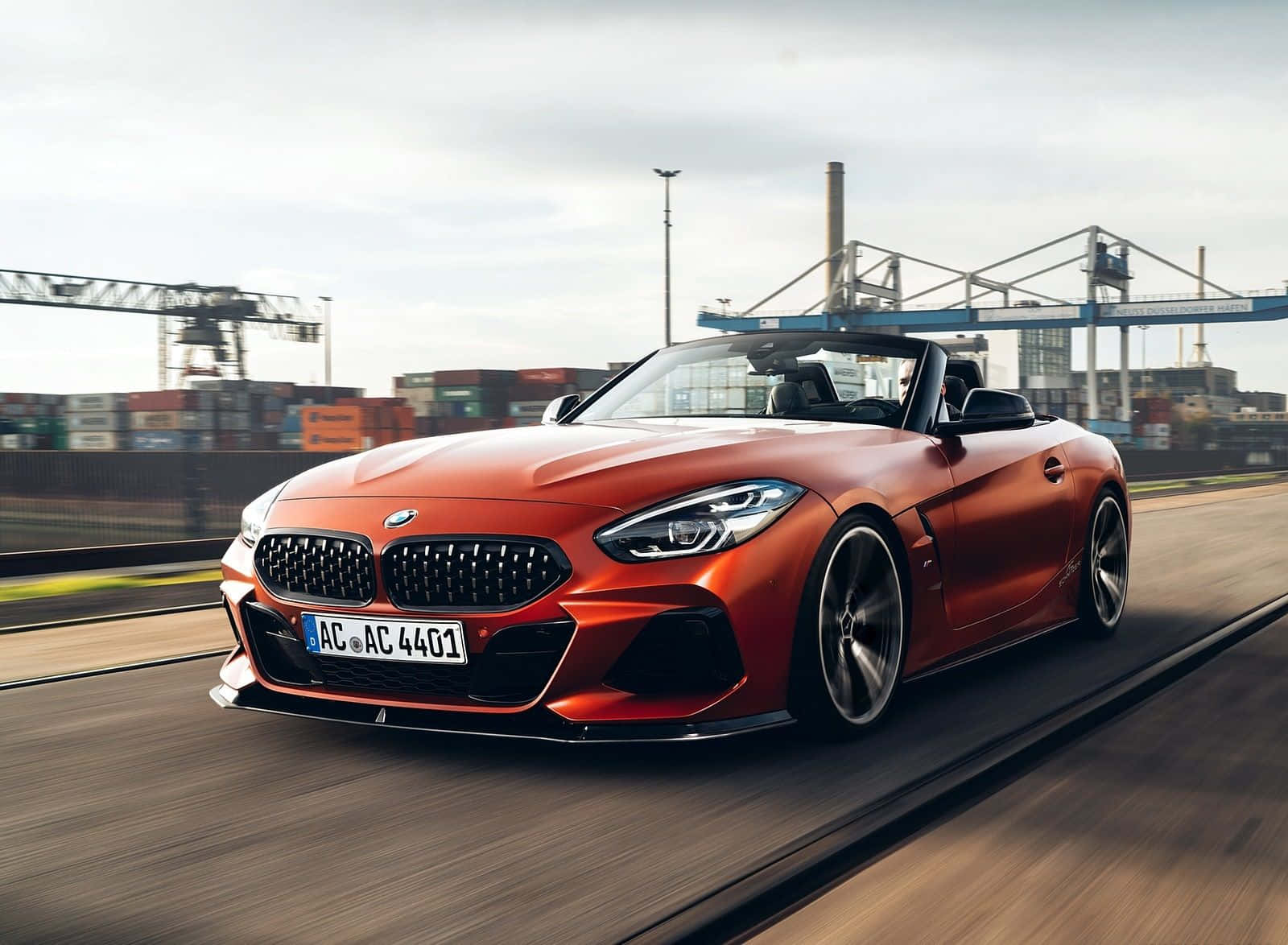 Stunning Bmw Z4 Car On Road Wallpaper