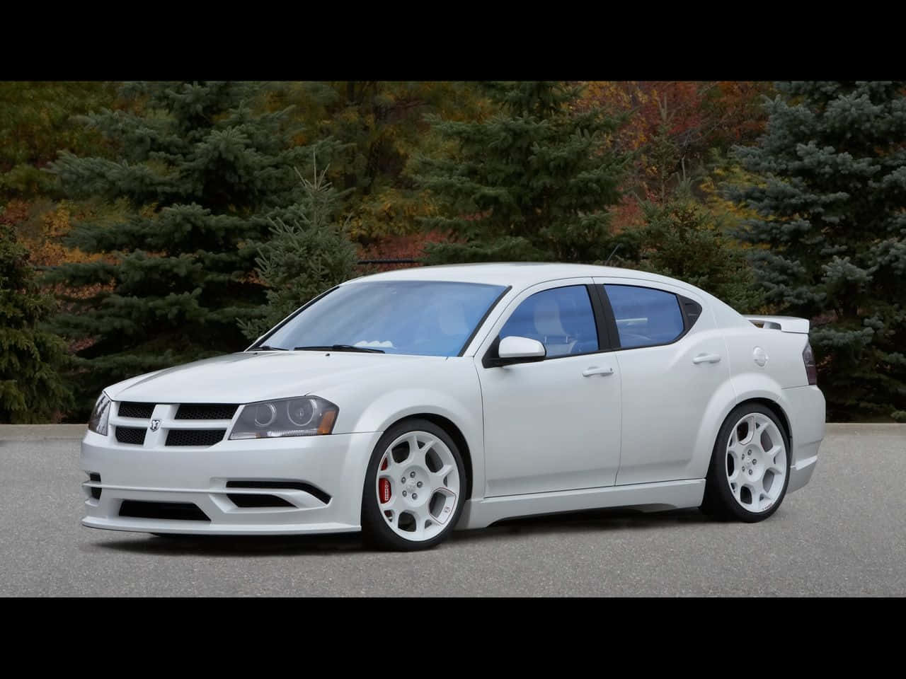 Stunning Dodge Avenger Gliding On The Highway Wallpaper