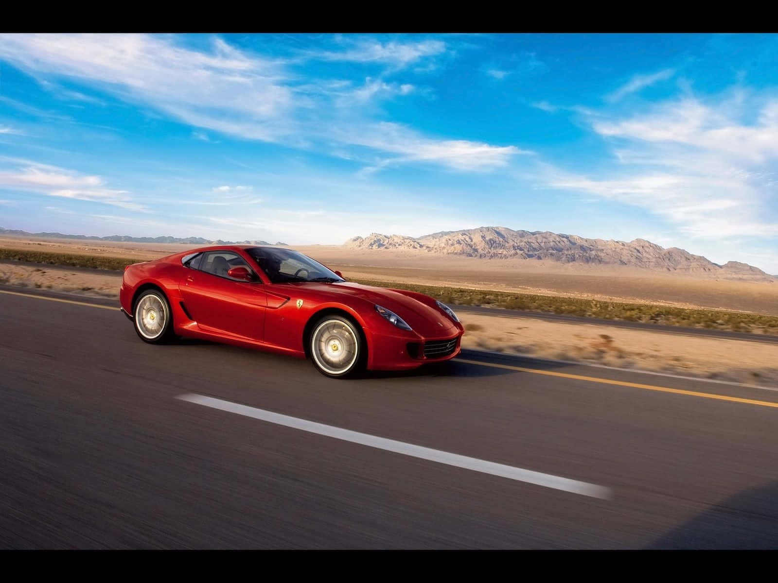 Stunning Ferrari 599 Gtb Fiorano On The Open Road Wallpaper