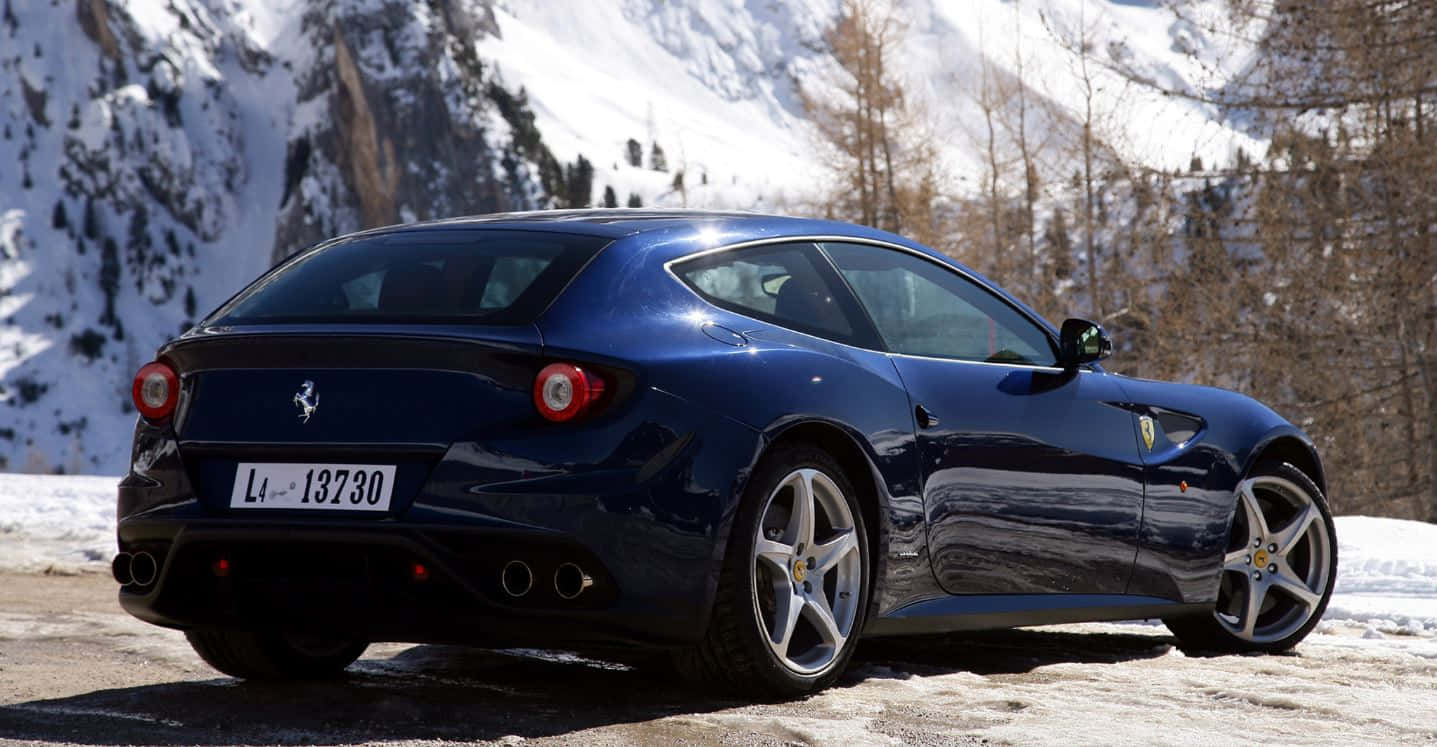 Stunning Ferrari Ff Cruising On An Open Road Wallpaper