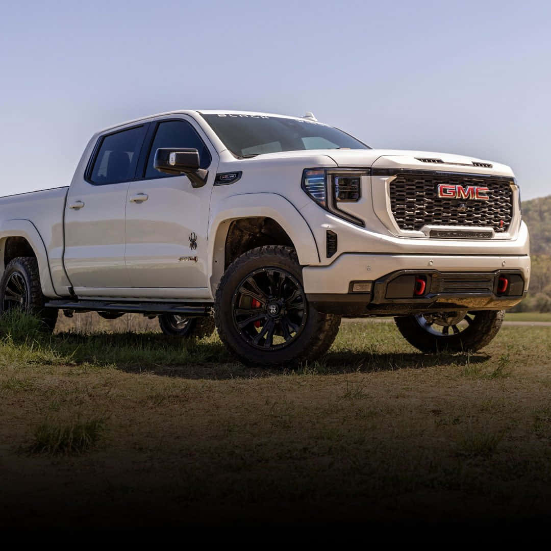 Stunning Gmc Sierra In Off-road Adventure Wallpaper