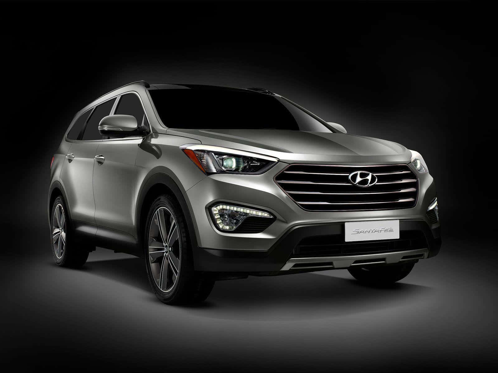 Stunning Hyundai Santa Fe On A Scenic Road Wallpaper