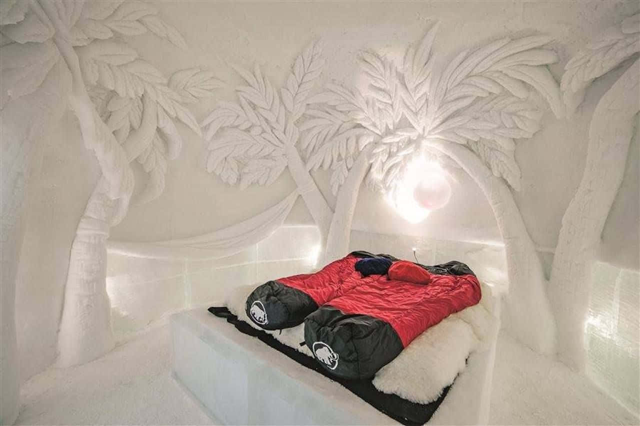 Stunning Ice Hotel Suite With Beautiful Sculptures And Snowflakes Wallpaper